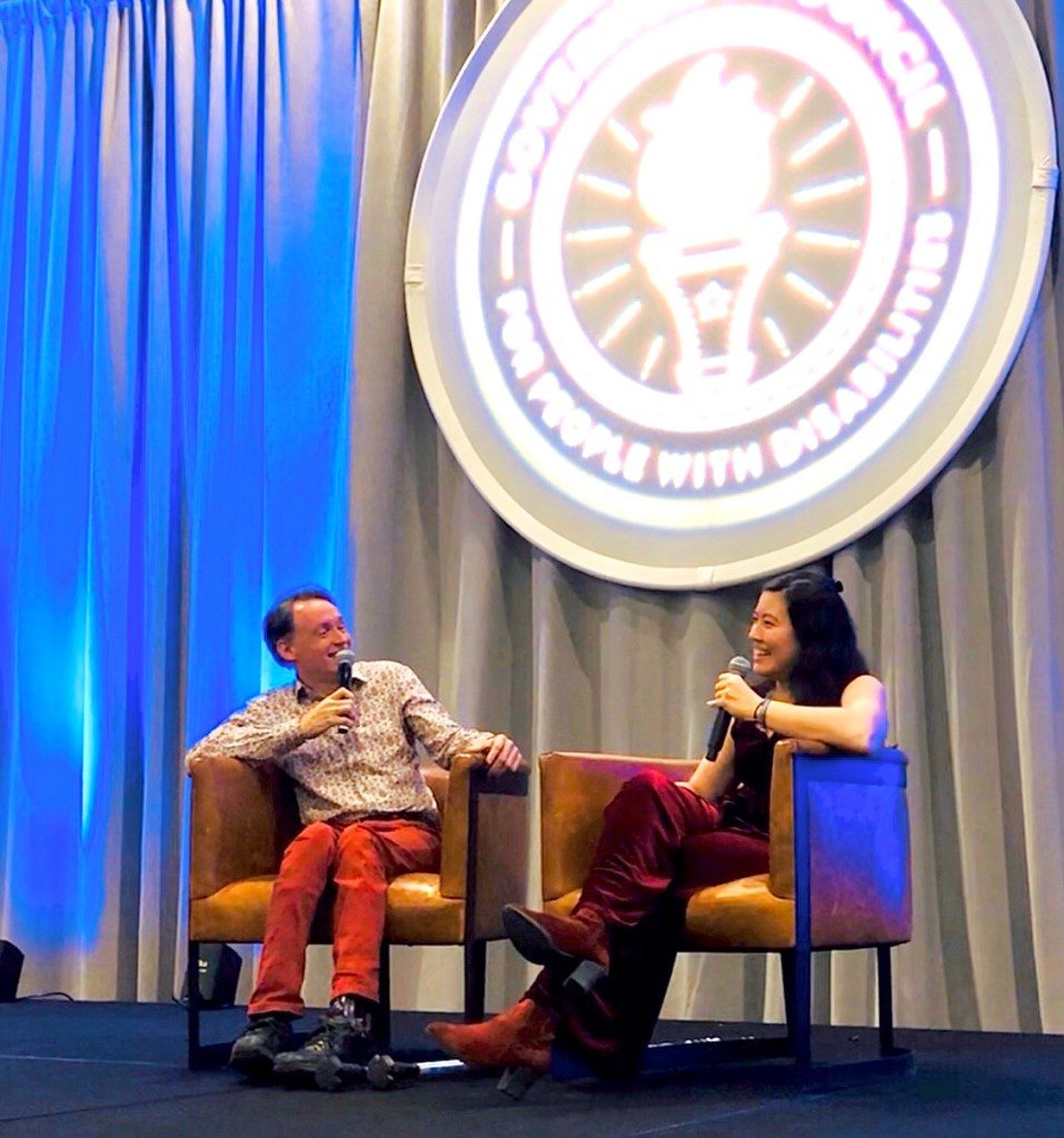 Xian in conversation with activist Lawrence Carter-Long at the Governor's Council for People with Disabilities in Indiana